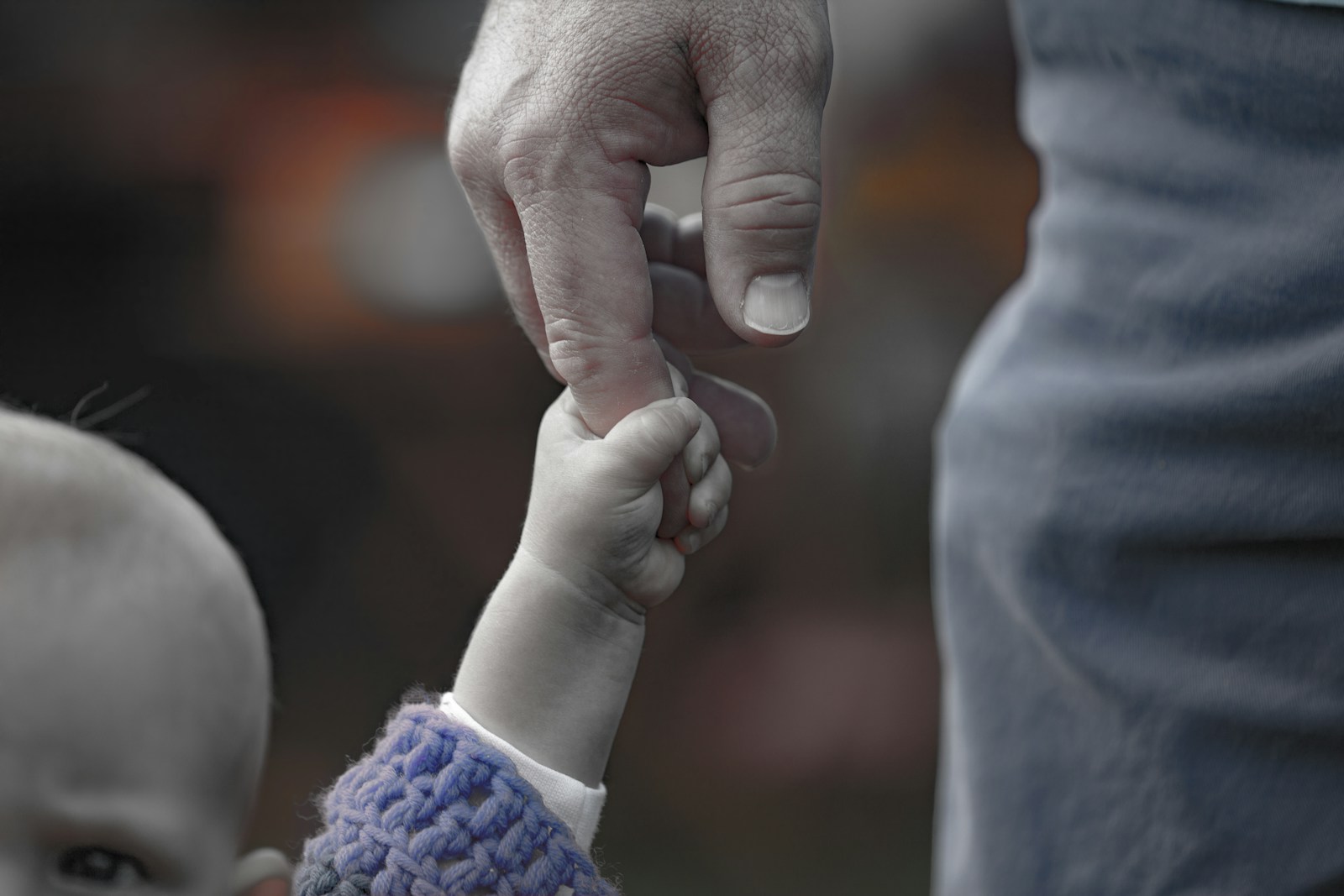 person holding babys hand